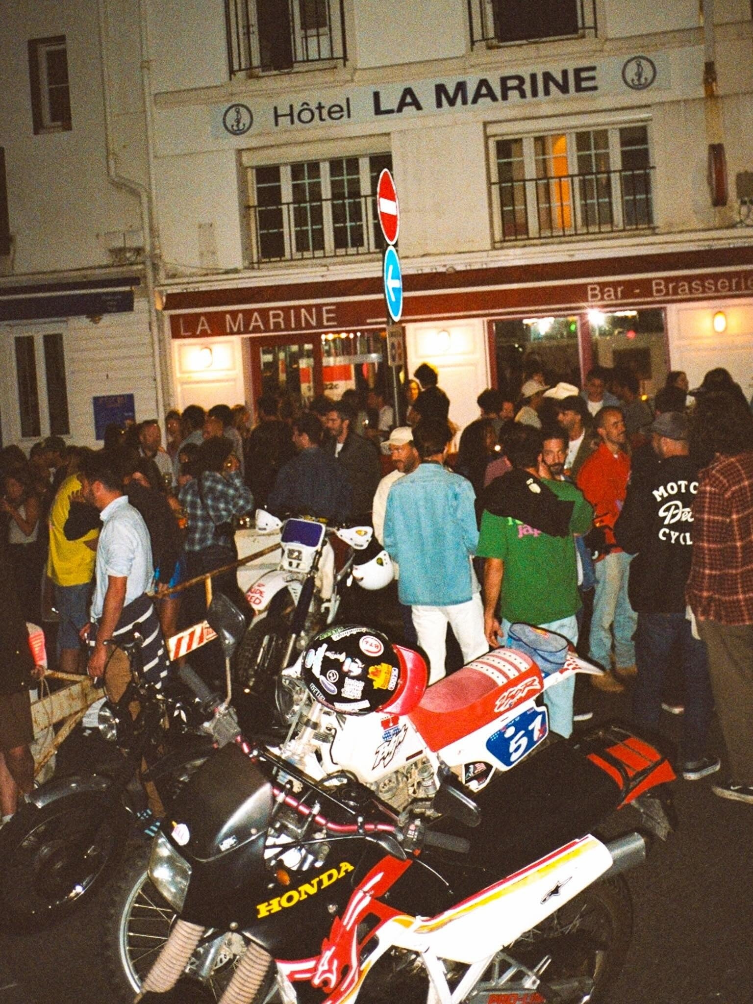 Biarritz nighttime gathering with motorcycles outside La Marine — owner-selected exhibition image