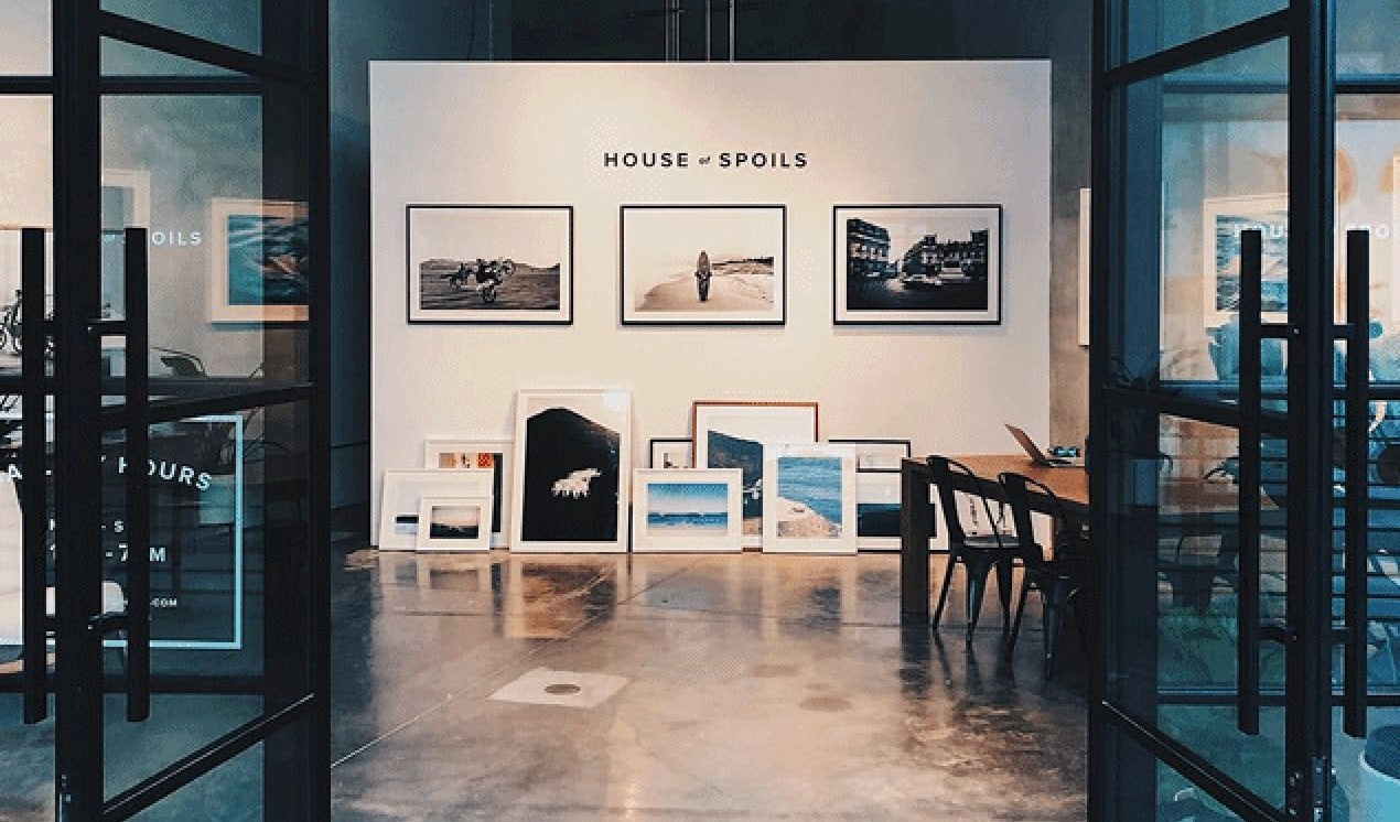 Culver City gallery through open doors with framed photographs and House of Spoils sign — owner-selected exhibition image