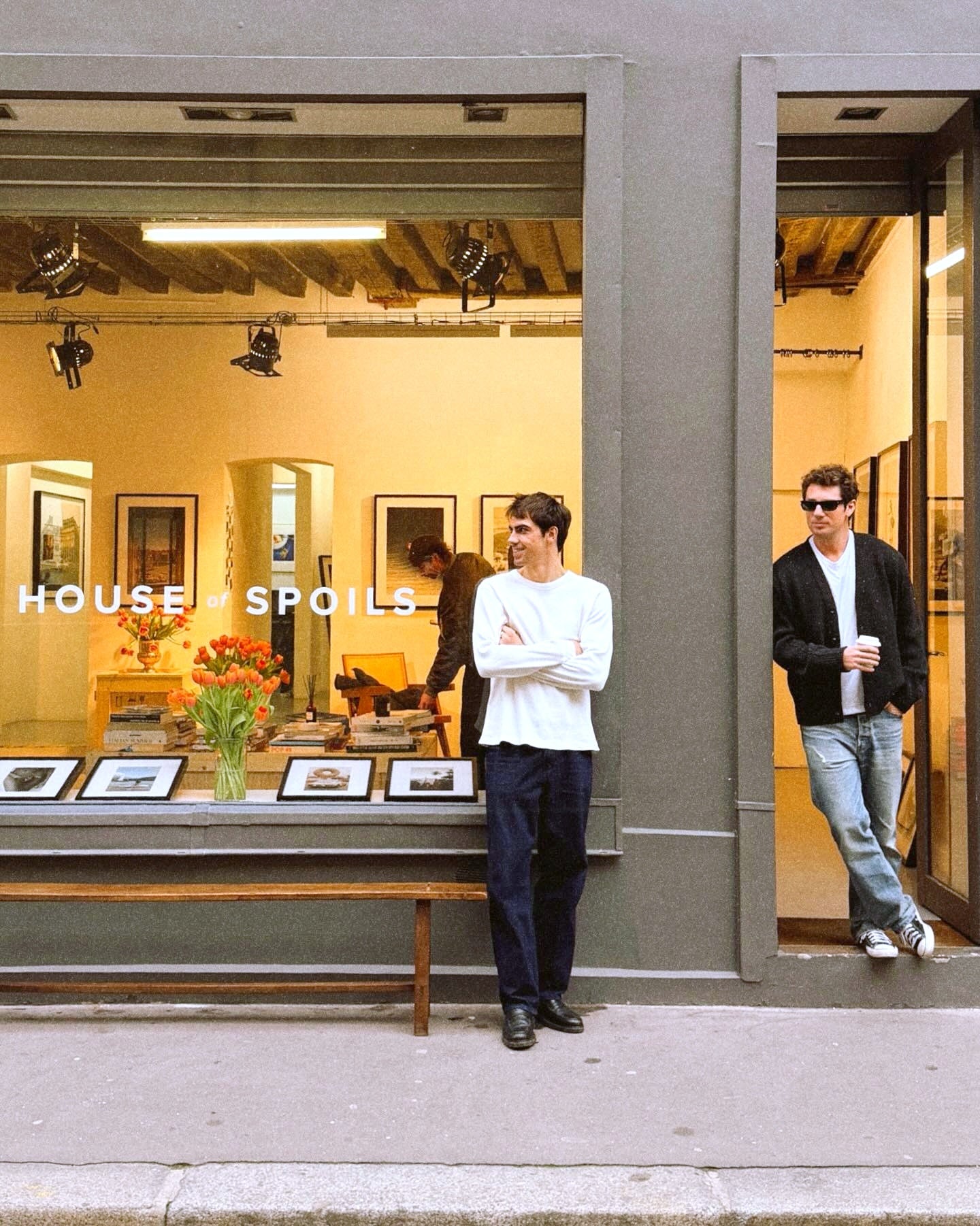Paris gallery storefront with people and framed photographs — owner-selected exhibition image